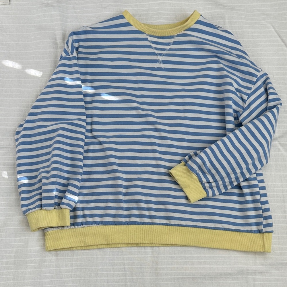 Blue and White Striped Sweatshirt with Yellow Accents